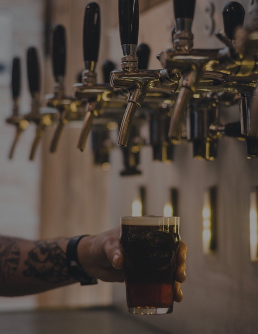 Happy client holding a beer